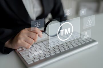 computer with the letters tm on the screen; orange county business law