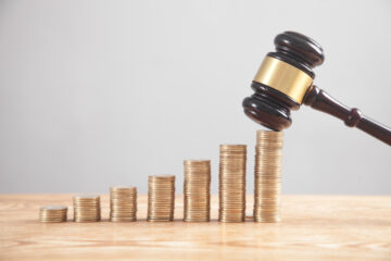 gavel with line of coins; best litigation attorney orange county